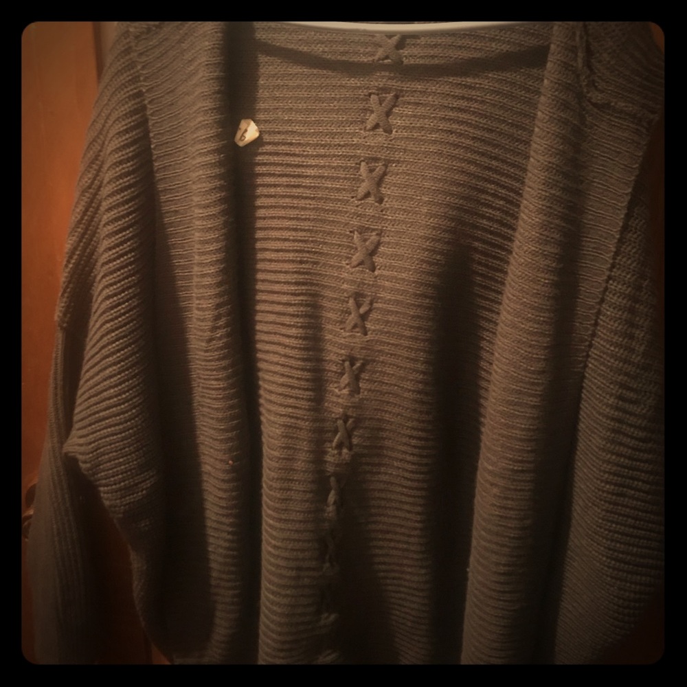 It’s a olive green sweater top